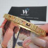Close-up of the Greek Key Bangle showing intricate Greek pattern design with 18K gold plating and Cubic Zirconia sparkle, emphasizing the texture and fine craftsmanship.