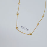 Close-up of Wava Chic Multi-Dot Stranded Necklace – six bezel-set diamond imitations on a delicate 18K gold-plated stainless steel chain, 17.5-19.5 inches.