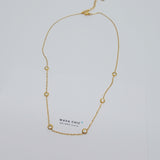 Close-up of Wava Chic Multi-Dot Stranded Necklace – six bezel-set diamond imitations on a delicate 18K gold-plated stainless steel chain, 17.5-19.5 inches.