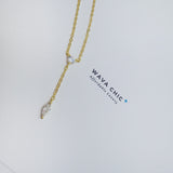 Close-up view of the Dot & Drape Diamond Necklace featuring bezel-set cubic zirconia stones along a dainty gold-plated sterling silver chain. The image highlights the precise craftsmanship and delicate drape, showcasing how each sparkling CZ stone is evenly spaced for a modern, refined look.