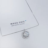 Close-up of the Cushion Halo Sparkle Necklace, showing the cushion-cut CZ stone in the center, surrounded by a brilliant halo of pavé cubic zirconia, all set in polished 925 sterling silver. Captures the detailed craftsmanship and radiant sparkle of the piece.