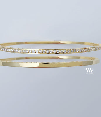 two 14K gold and diamond bangles