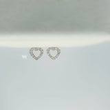 heart shaped ear studs made with 18 karat gold set with high quality round brilliant diamond.