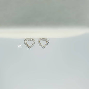 heart shaped ear studs made with 18 karat gold set with high quality round brilliant diamond.