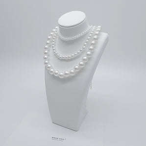 Close-up of the Pearl Affair Necklace featuring uniform imitation pearls (available in 10mm, 6mm, or 4mm sizes), 18K gold plated titanium steel base, and a secure lobster clasp closure. Glossy pearls and sleek gold finish highlight the craftsmanship.
