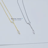 Close-up view of the Dot & Drape Diamond Necklace featuring bezel-set cubic zirconia stones along a dainty gold-plated sterling silver chain. The image highlights the precise craftsmanship and delicate drape, showcasing how each sparkling CZ stone is evenly spaced for a modern, refined look.
