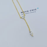 Close-up view of the Dot & Drape Diamond Necklace featuring bezel-set cubic zirconia stones along a dainty gold-plated sterling silver chain. The image highlights the precise craftsmanship and delicate drape, showcasing how each sparkling CZ stone is evenly spaced for a modern, refined look.
