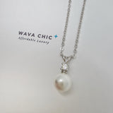 Close-up of the Bunny Pearl Necklace showing a lustrous faux pearl drop paired with a clear solitaire cubic zirconia stone set in 925 sterling silver. The design is delicate and bright, offering a graceful sparkle with a polished, refined finish.