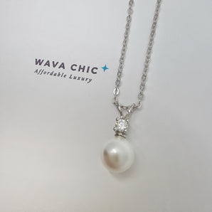 Close-up of the Bunny Pearl Necklace showing a lustrous faux pearl drop paired with a clear solitaire cubic zirconia stone set in 925 sterling silver. The design is delicate and bright, offering a graceful sparkle with a polished, refined finish.
