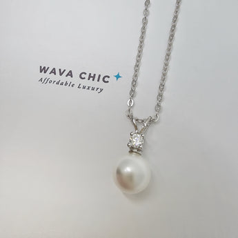 Close-up of the Bunny Pearl Necklace showing a lustrous faux pearl drop paired with a clear solitaire cubic zirconia stone set in 925 sterling silver. The design is delicate and bright, offering a graceful sparkle with a polished, refined finish.