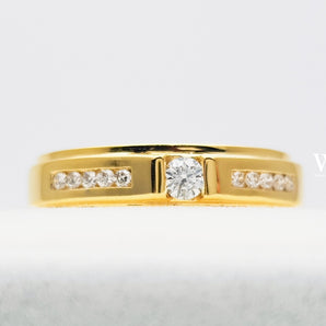 Gold ring with Center piece of 0.10 ct., 10 pieces of side diamonds