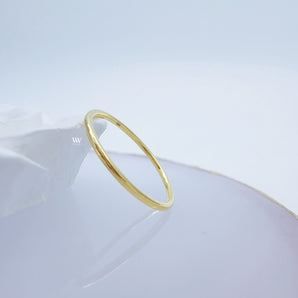 Plain solid gold ring made with 18 karat gold.