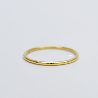 Plain solid gold ring made with 18 karat gold.