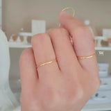 Plain solid gold ring made with 18 karat gold.