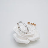 A photograph of 2 chain rings with one white gold and another rose gold