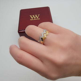 Zigzag solid gold and diamond rings on model hands