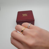 Zigzag solid gold and diamond rings on model hands